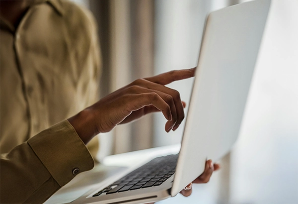 woman accepting a proposal on a laptop