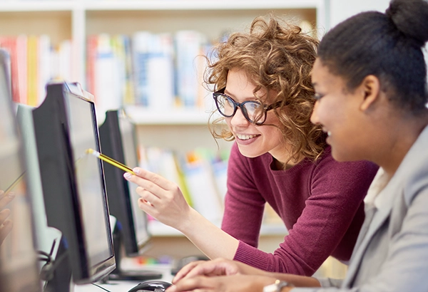 two women reviewing a mock up from Pasadena Web Design Studio